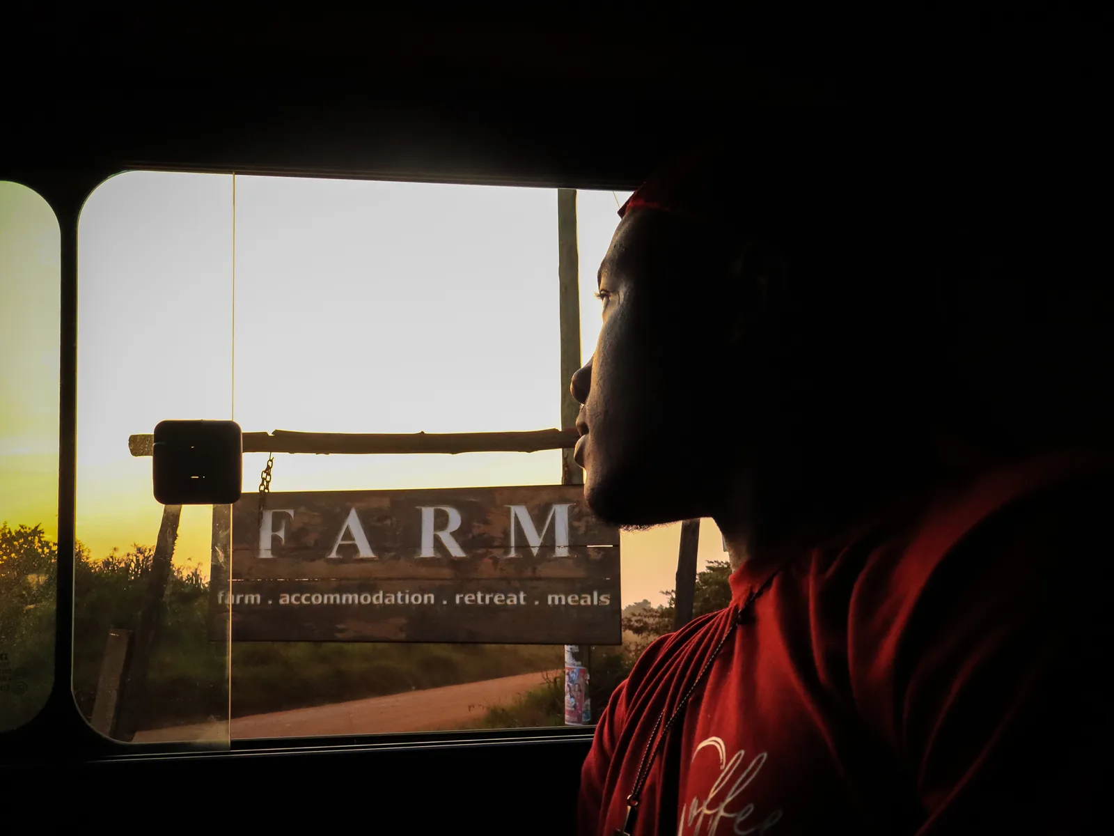 Arriving at a partner coffee farm gate at golden hour